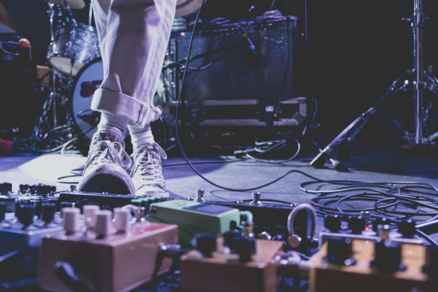 Sound design workspace with acoustic treatment and monitoring equipment